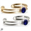 14K gold toe ring with single Sapphire gem