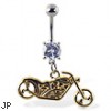 Navel ring with dangling yellow motorcycle