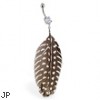 Belly ring with dangling brown and white spotted feather