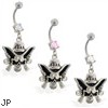 Navel ring with dangling cowboy skull and guns