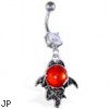 Navel ring with large dangling red stone with bat wings