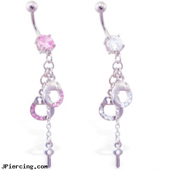 Navel ring with dangling jeweled handcuffs and key, gold navel piercings, navel ring gallery, navel piercing rejecting, naughty tongue rings, how to treat infected nipple rings