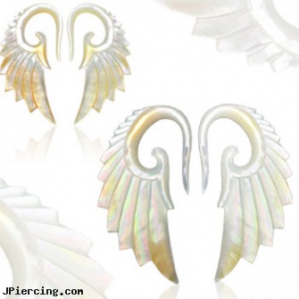 Pair of Hand carved mother of pearl angel wing tapers, torn penis piercing repair, nipple body jewelry in handcuff design, body piercing handbook, hand made navel rings, pearl navel ring